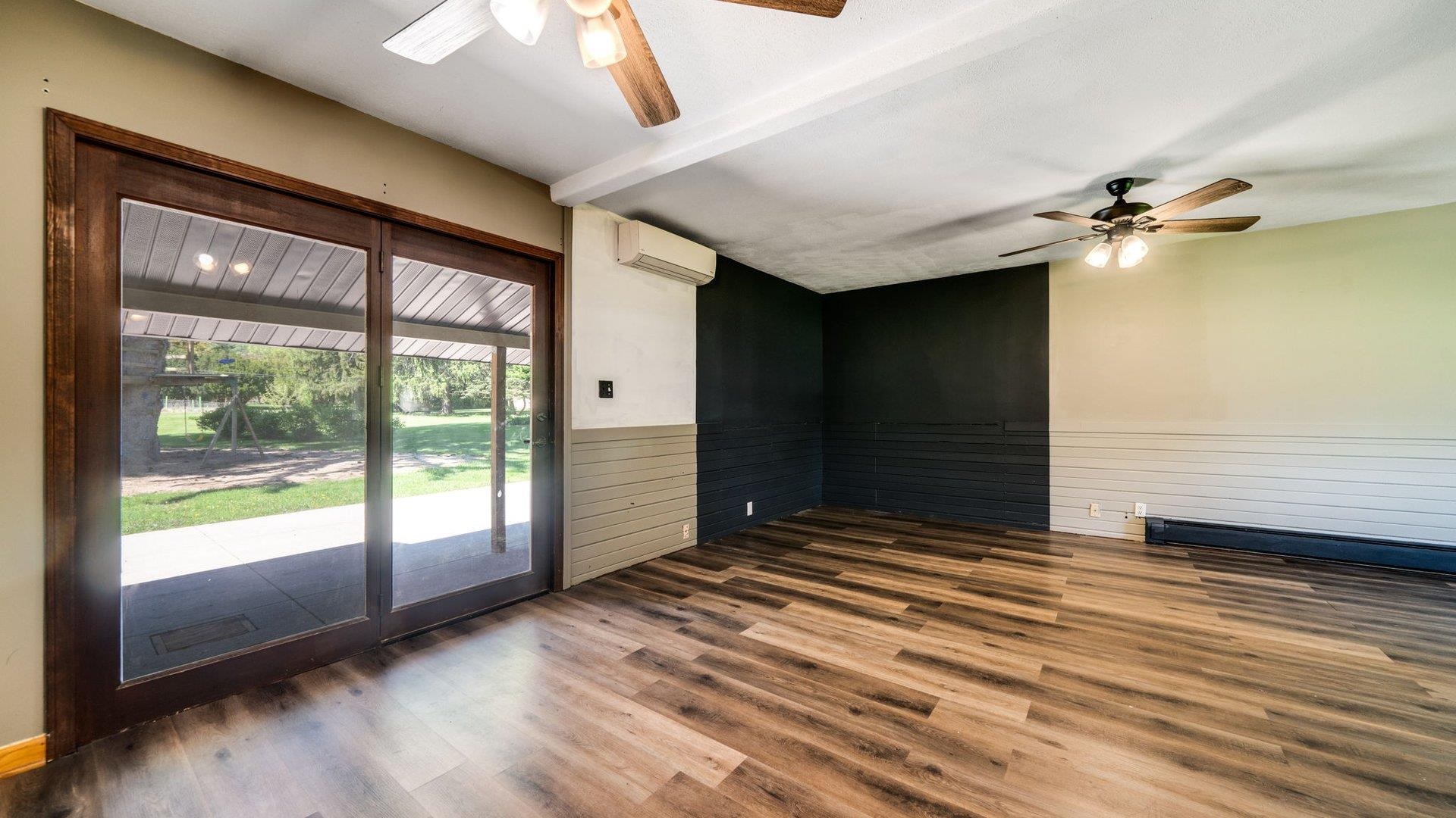 313 West Margaret Fuller Road Oregon, IL 61061 - Photo 15 of 46 a view of a livingroom with a ceiling fan and window