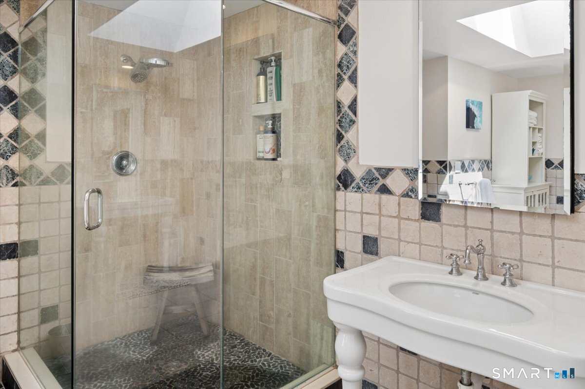 94 Vista Road Wilton, CT 06897 - Photo 24 of 38 a bathroom with a sink shower and a mirror