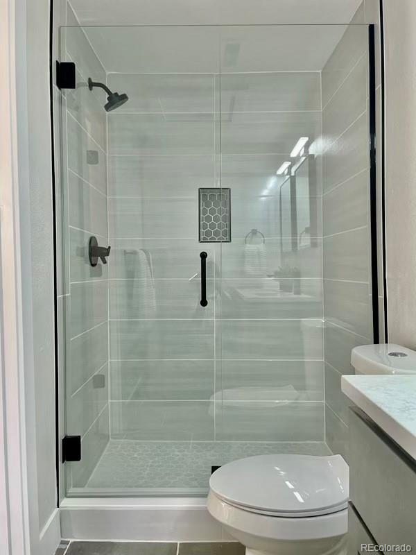 2925 Eaton Street Wheat Ridge, CO 80214 - Photo 20 of 30 a bathroom with a toilet and a shower