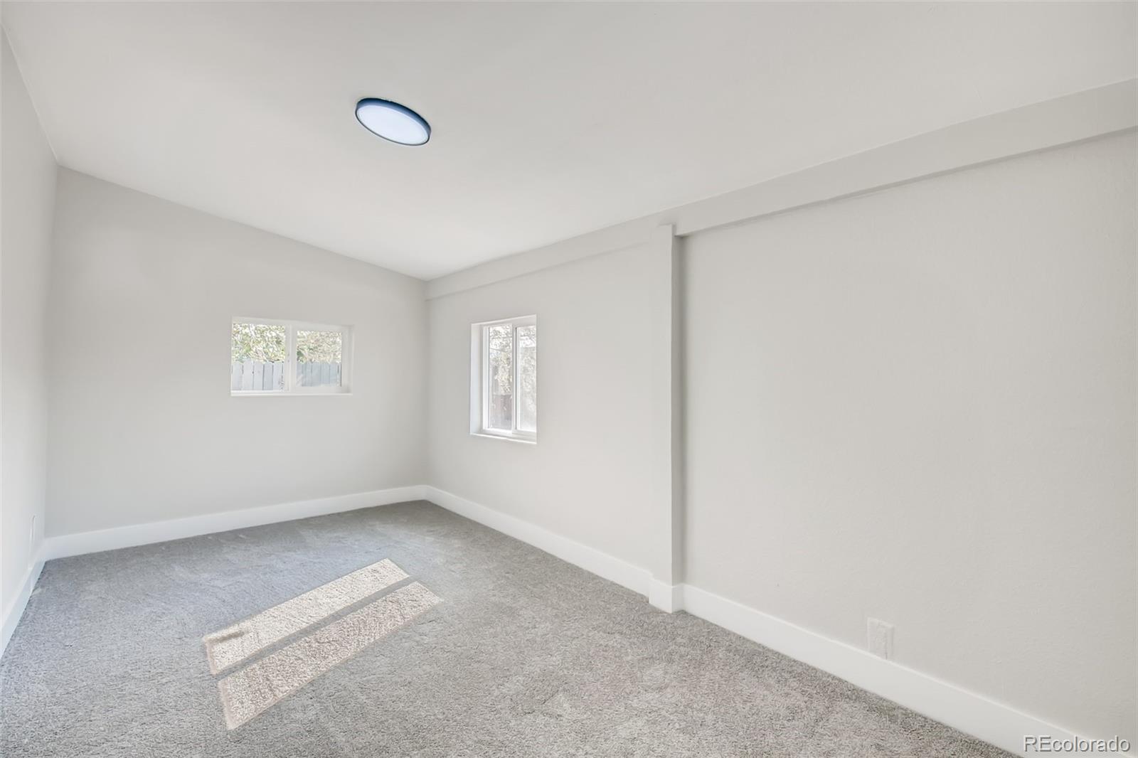 2925 Eaton Street Wheat Ridge, CO 80214 - Photo 23 of 30 a view of an empty room with a window