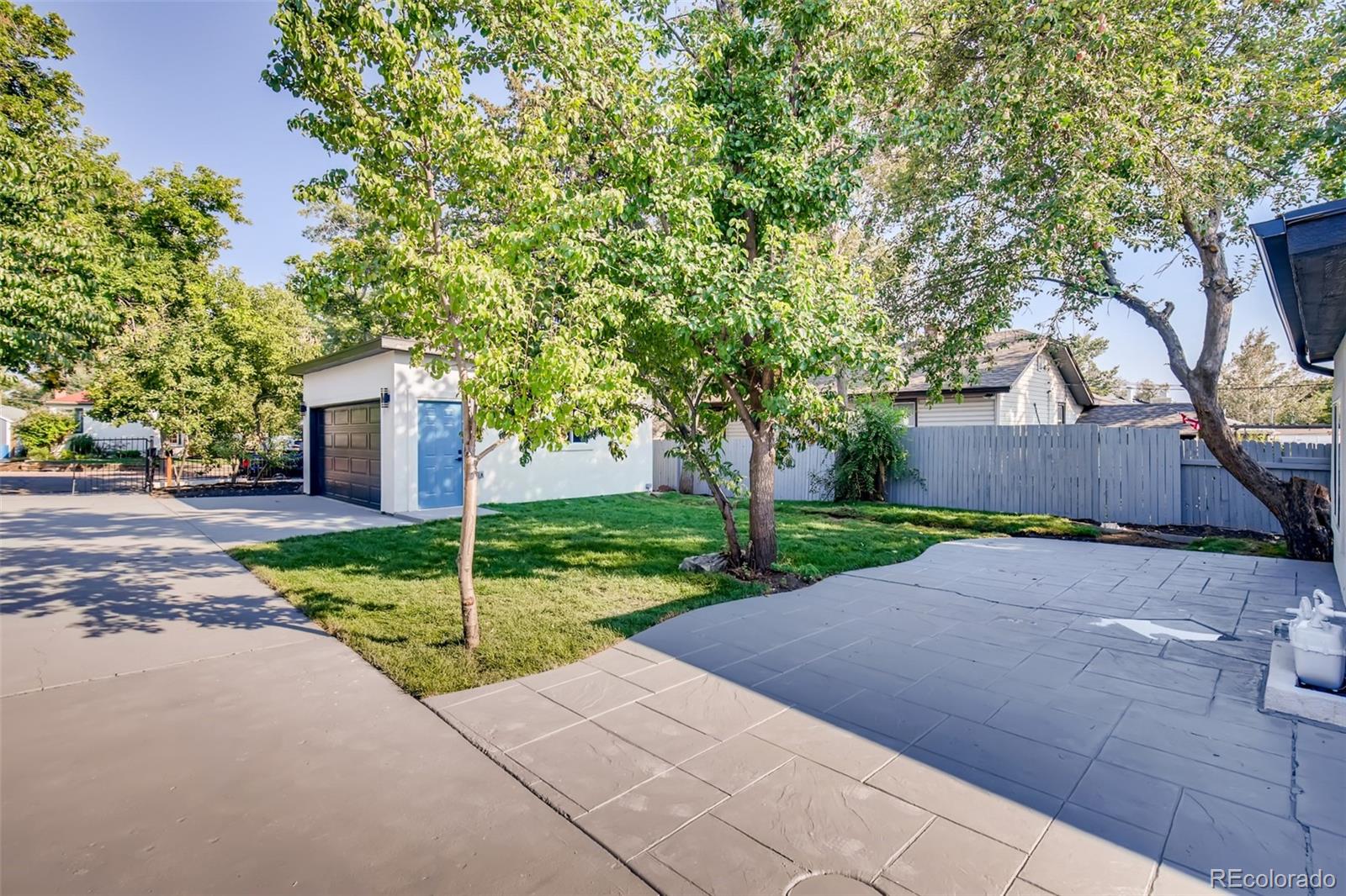 2925 Eaton Street Wheat Ridge, CO 80214 - Photo 27 of 30 a view of a house with a yard and large tree