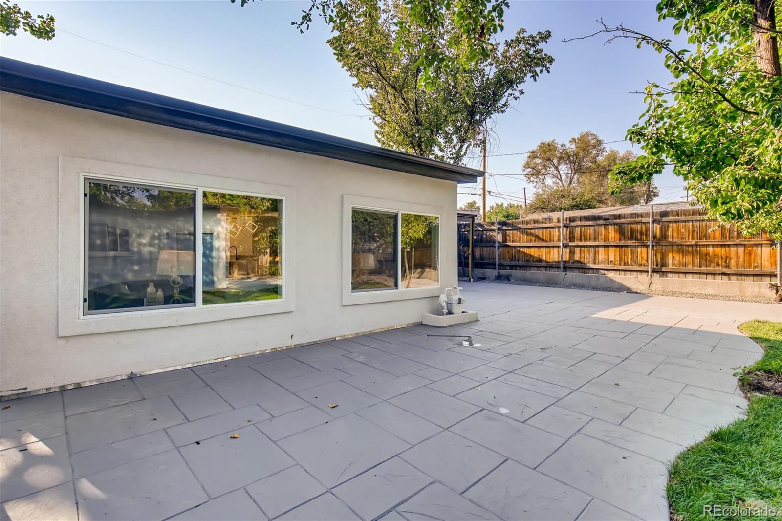 2925 Eaton Street Wheat Ridge, CO 80214 - Photo 29 of 30 front view of a house with a large tree