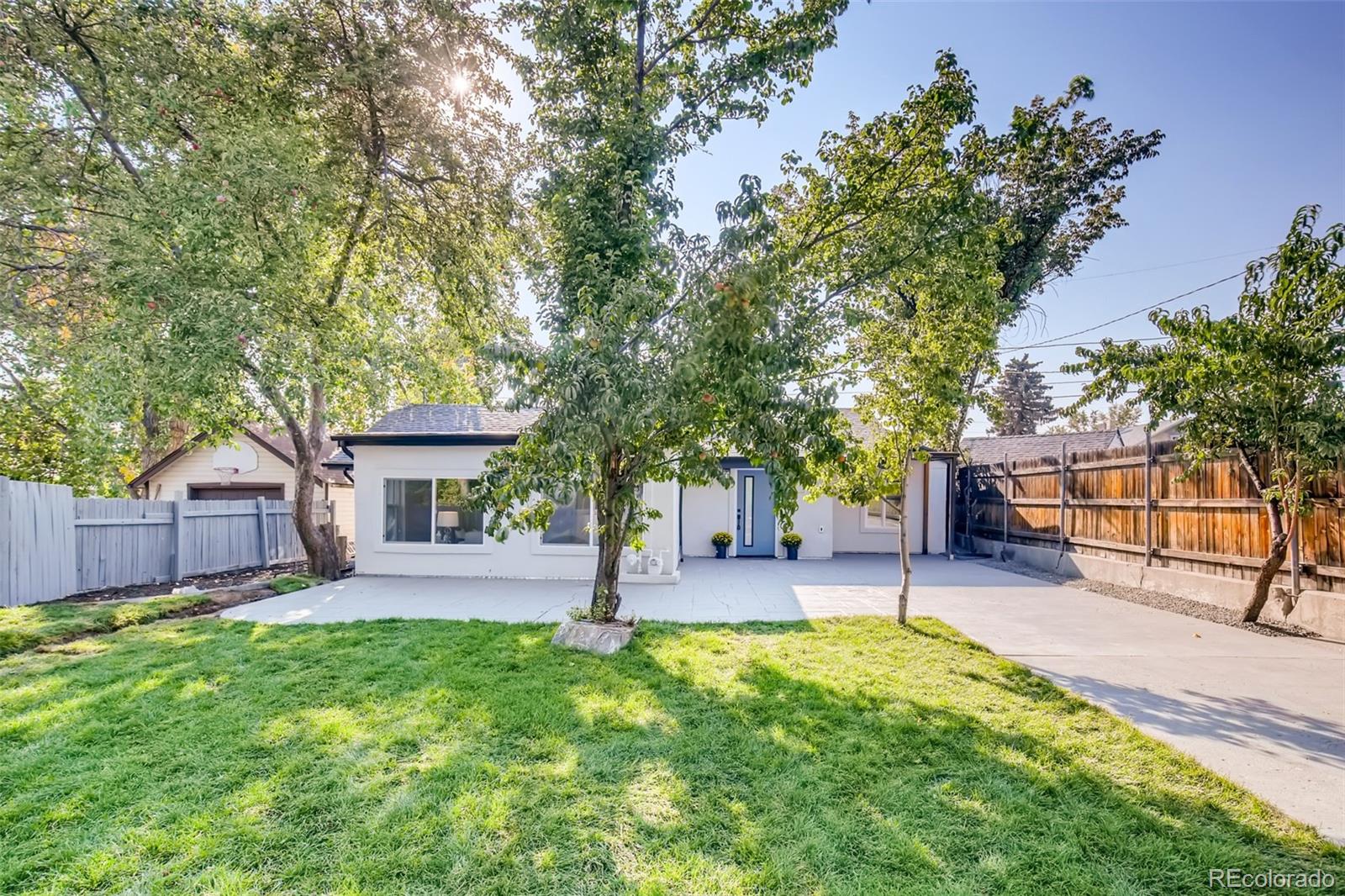 2925 Eaton Street Wheat Ridge, CO 80214 - Photo 4 of 30 a house view with a sitting space and garden