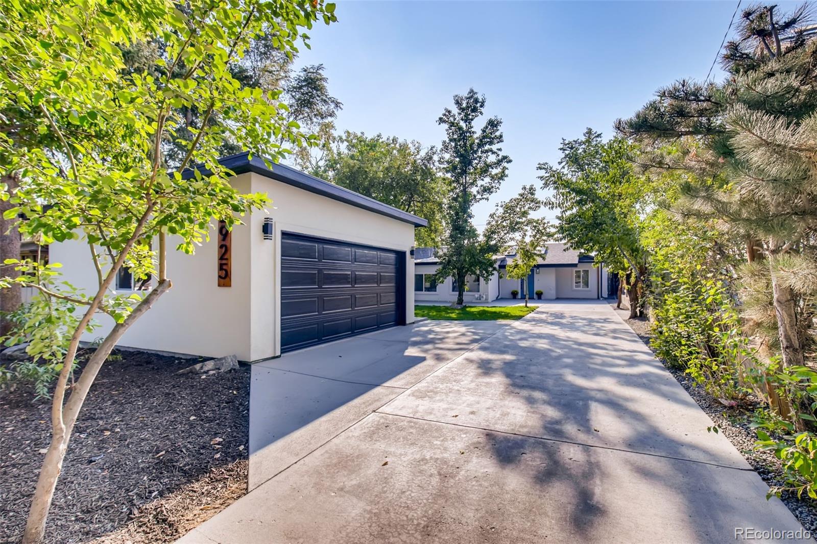 2925 Eaton Street Wheat Ridge, CO 80214 - Photo 5 of 30 a view of a back yard with green space