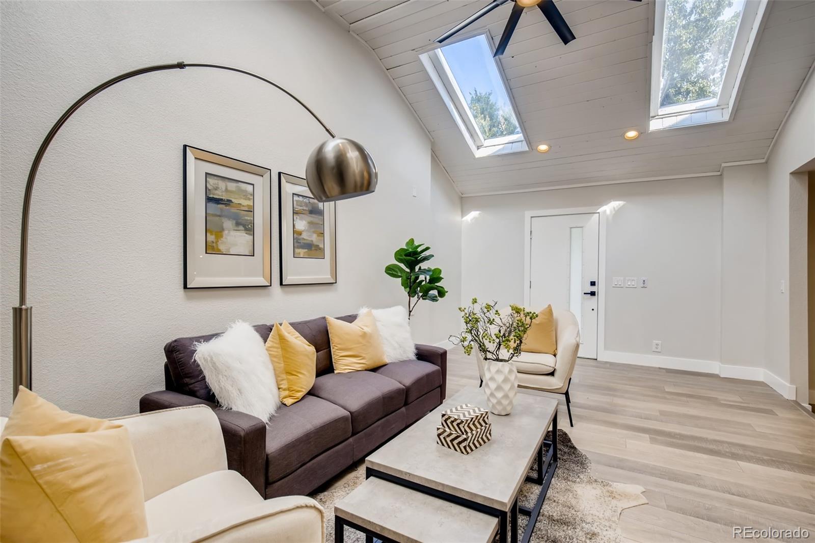 2925 Eaton Street Wheat Ridge, CO 80214 - Photo 9 of 30 a living room with furniture and wooden floor