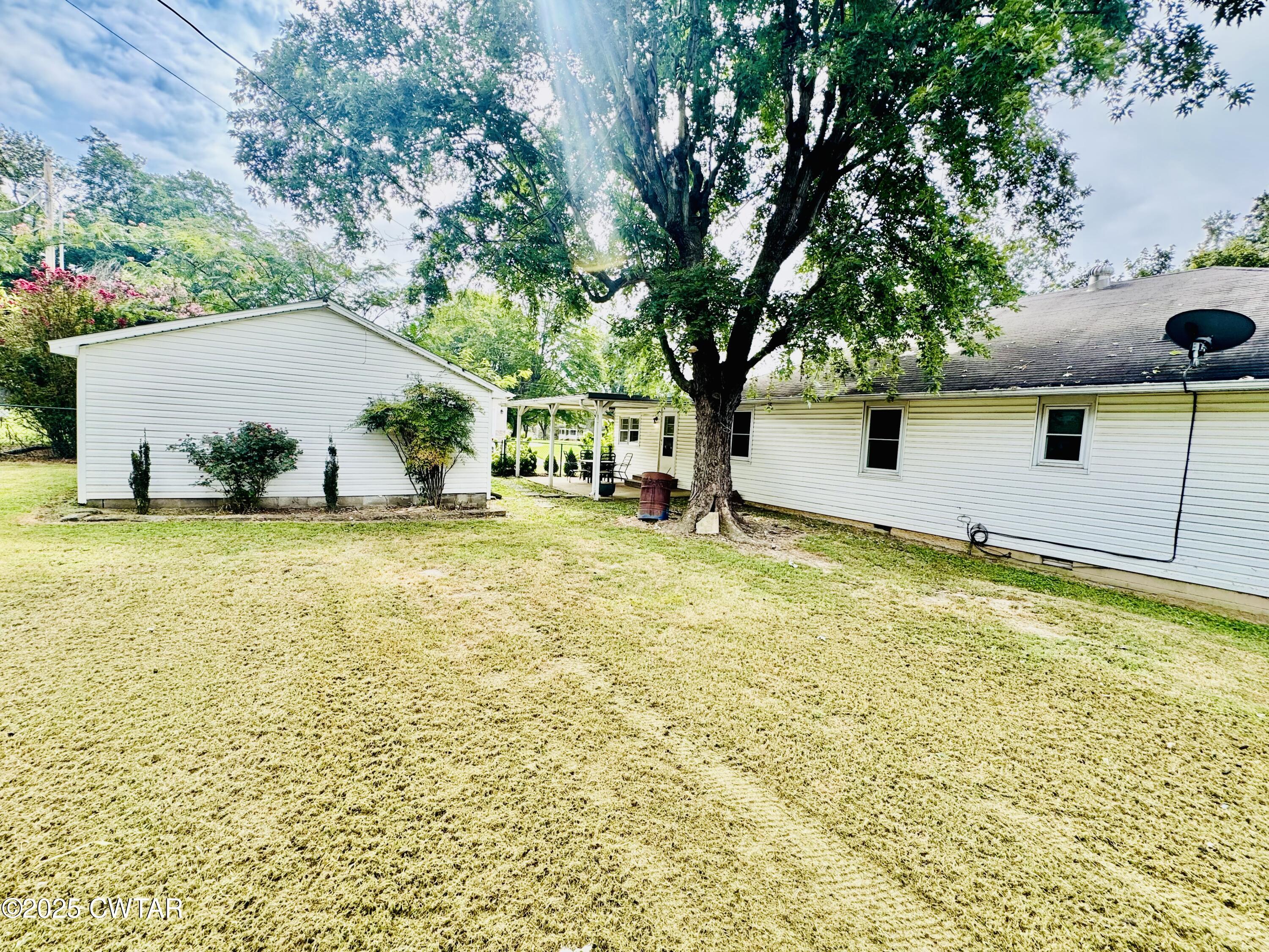 502 West Main Street Rutherford, TN 38369 - Photo 11 of 34 a swimming pool with outdoor seating and yard