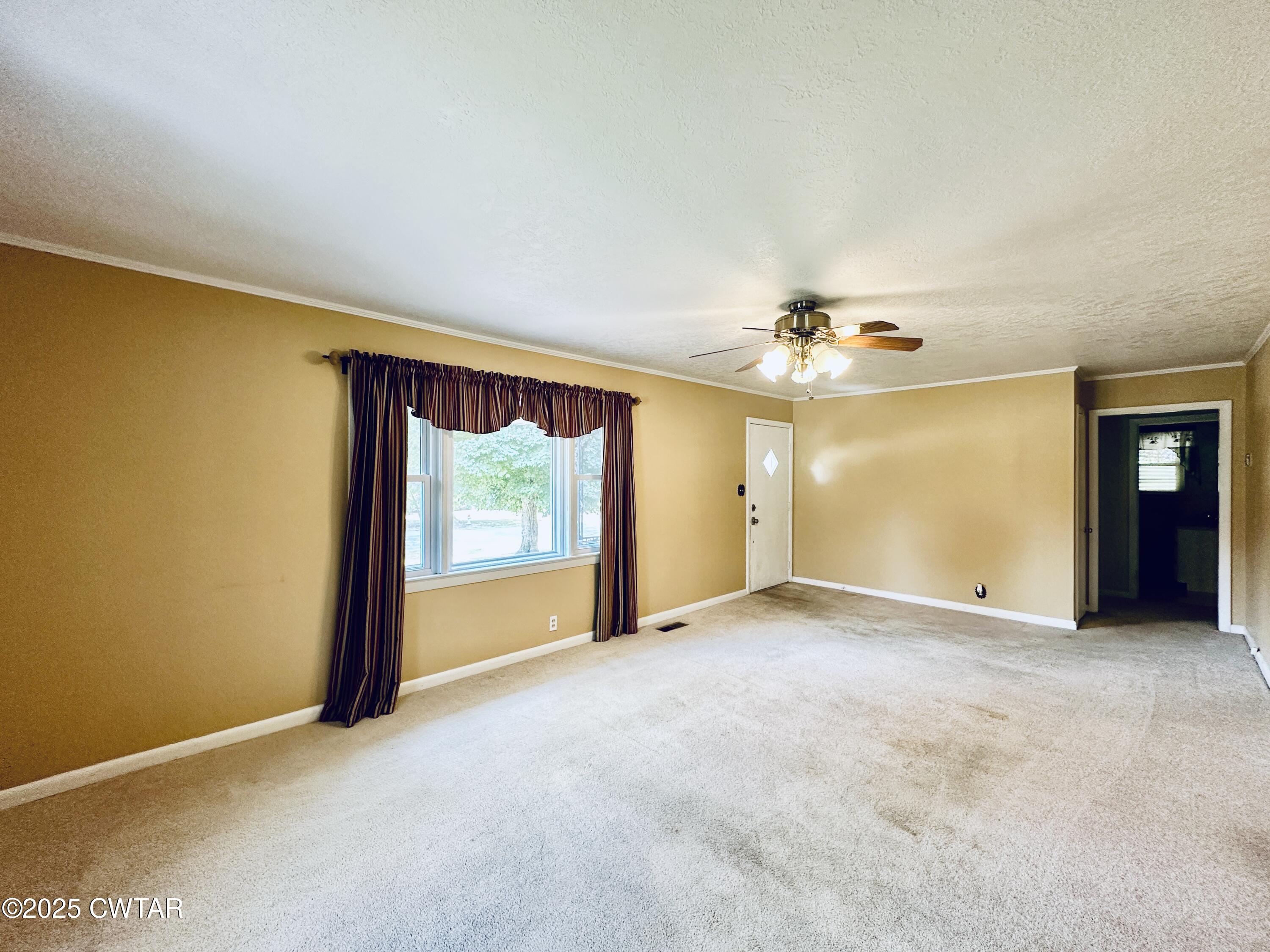 502 West Main Street Rutherford, TN 38369 - Photo 12 of 34 an empty room with a empty space and windows