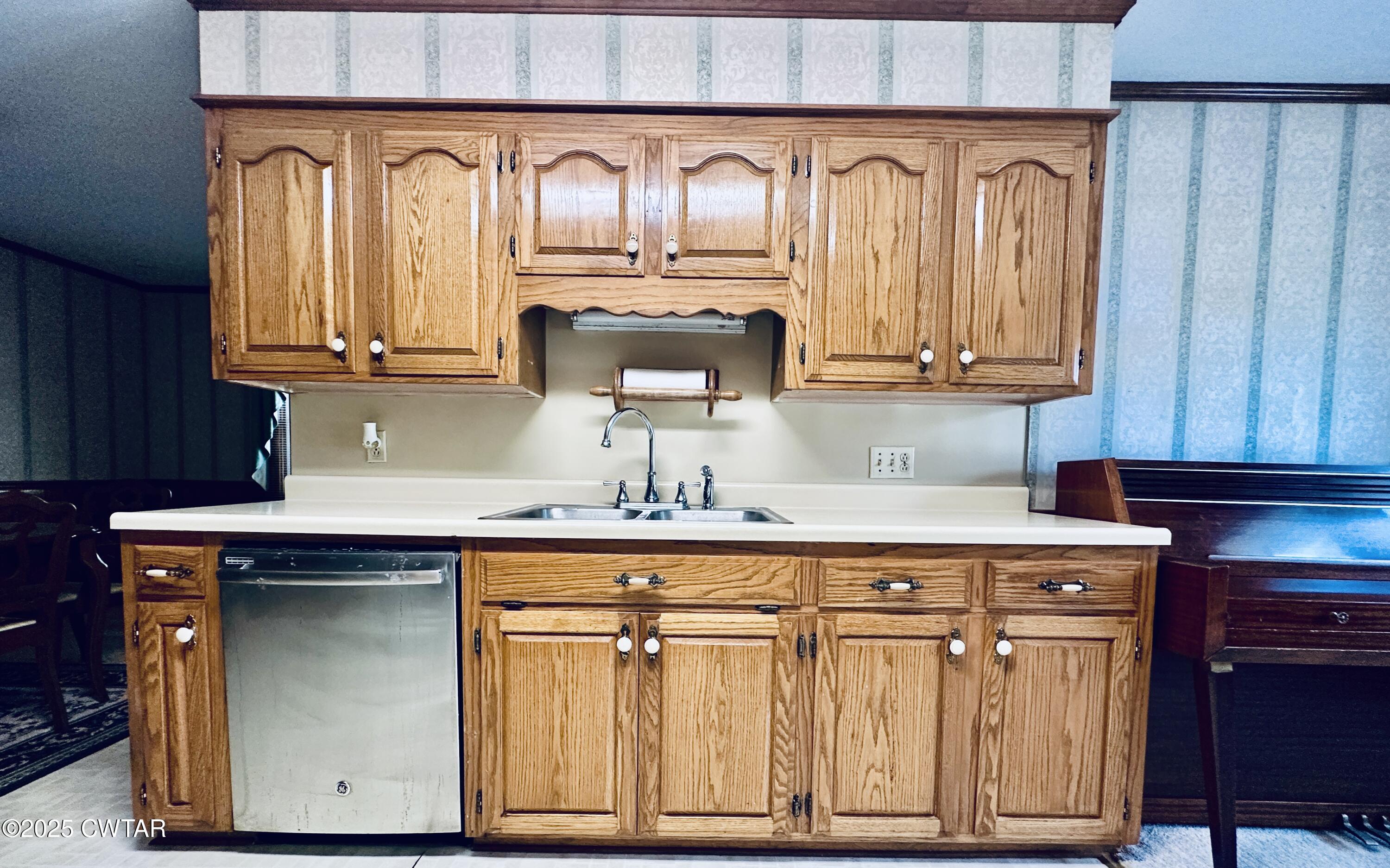 502 West Main Street Rutherford, TN 38369 - Photo 17 of 34 a kitchen with granite countertop wood cabinets and a sink