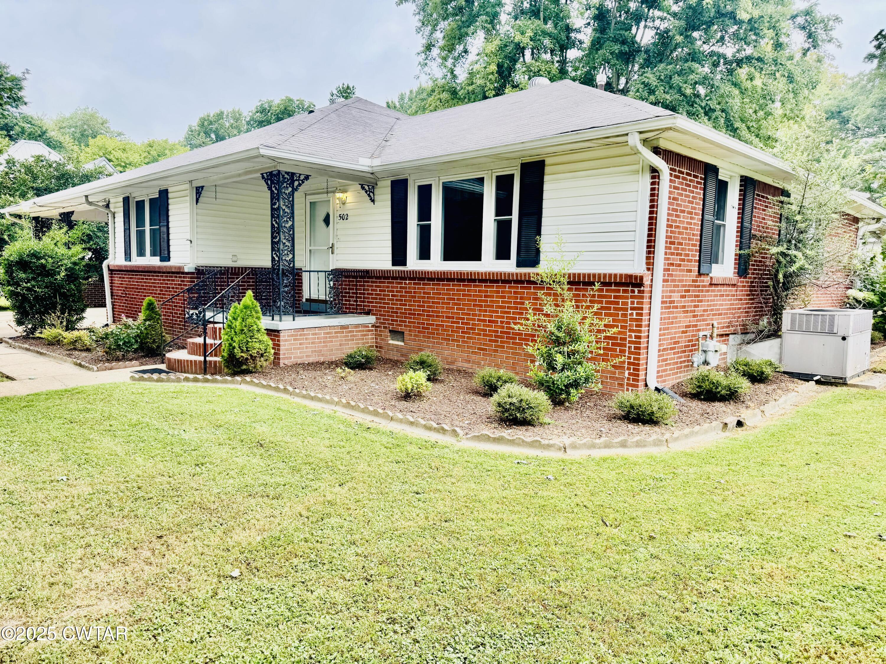502 West Main Street Rutherford, TN 38369 - Photo 2 of 34 a view of a house with a yard