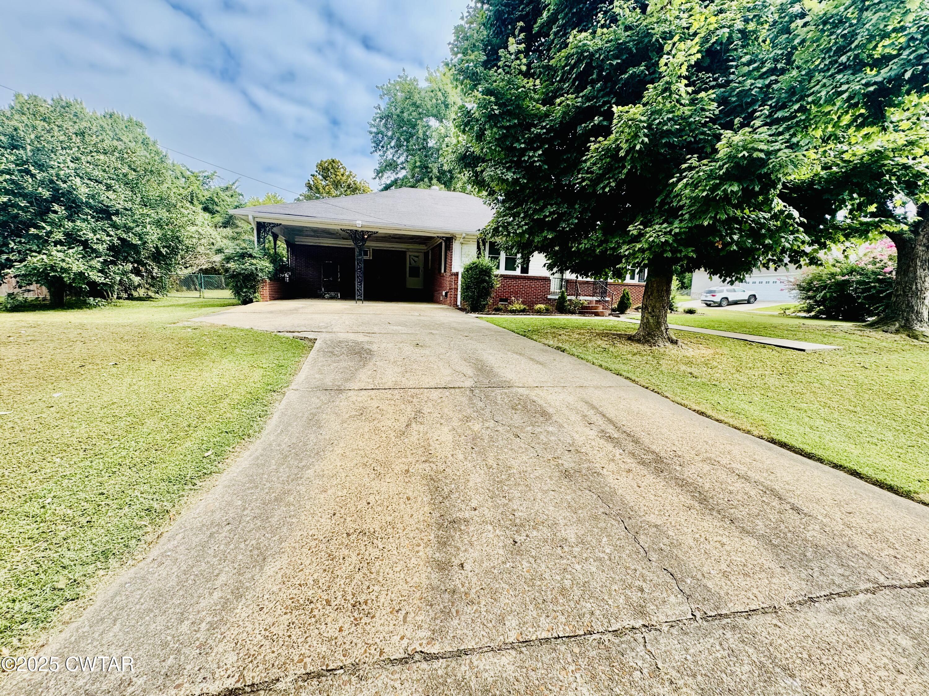 502 West Main Street Rutherford, TN 38369 - Photo 4 of 34 a view of house with garden space and trees in the background