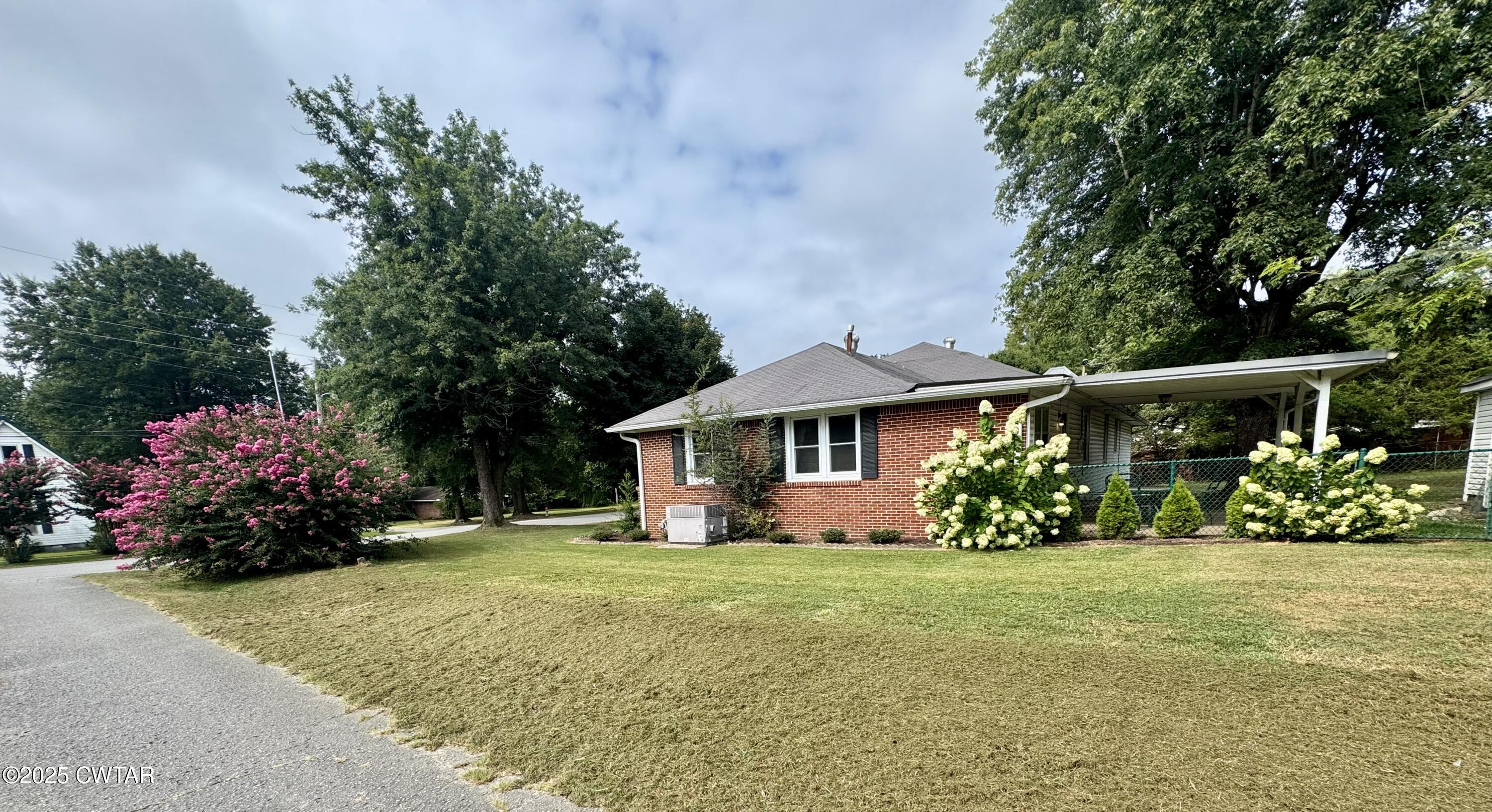 502 West Main Street Rutherford, TN 38369 - Photo 7 of 34 a front view of a house with a yard