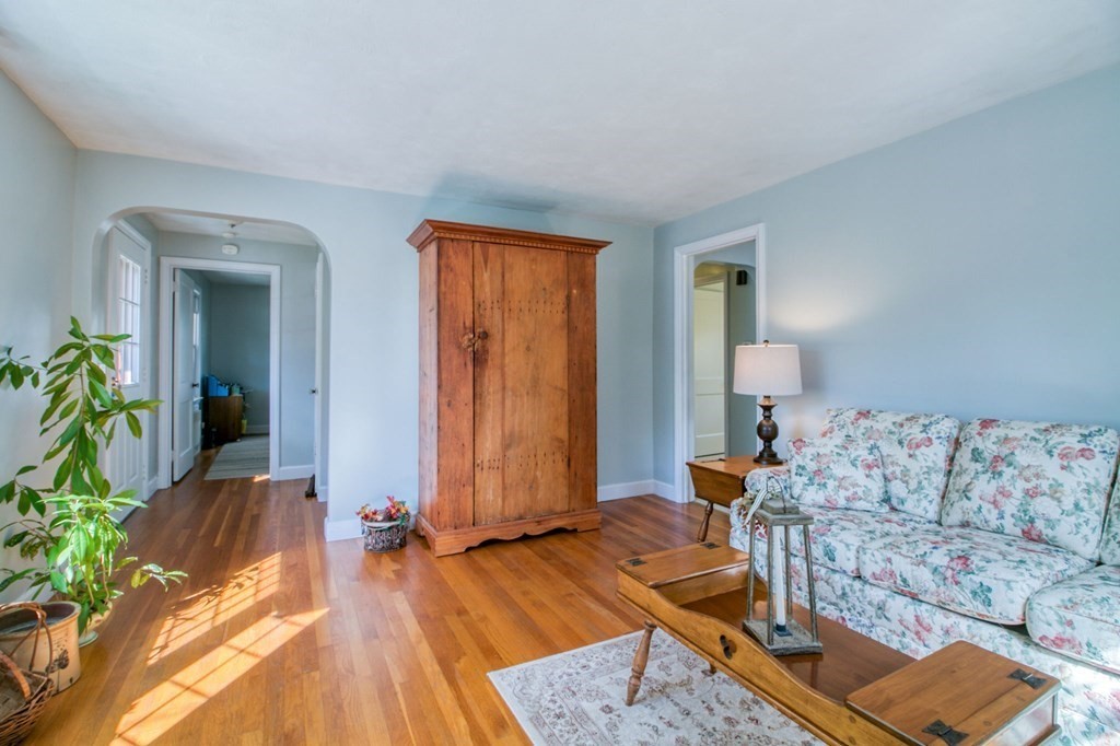 29 Harkness Avenue Springfield, MA 01118 - Photo 6 of 18 a living room with furniture and a wooden floor