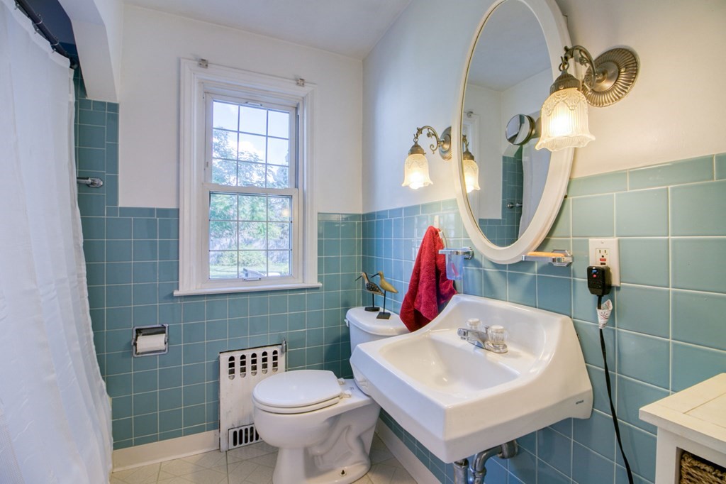 29 Harkness Avenue Springfield, MA 01118 - Photo 10 of 18 a bathroom with a sink toilet and a mirror
