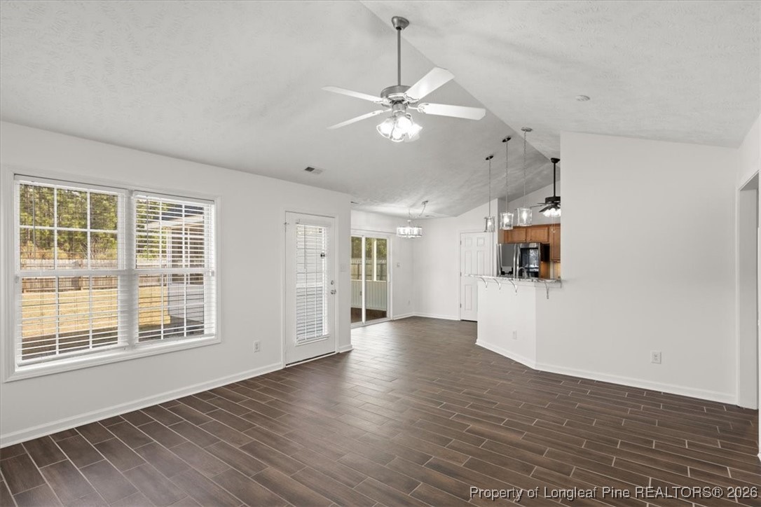 6649 Hillbrook Road Hope Mills, NC 28348 - Photo 12 of 37 a view of an empty room with window and wooden floor
