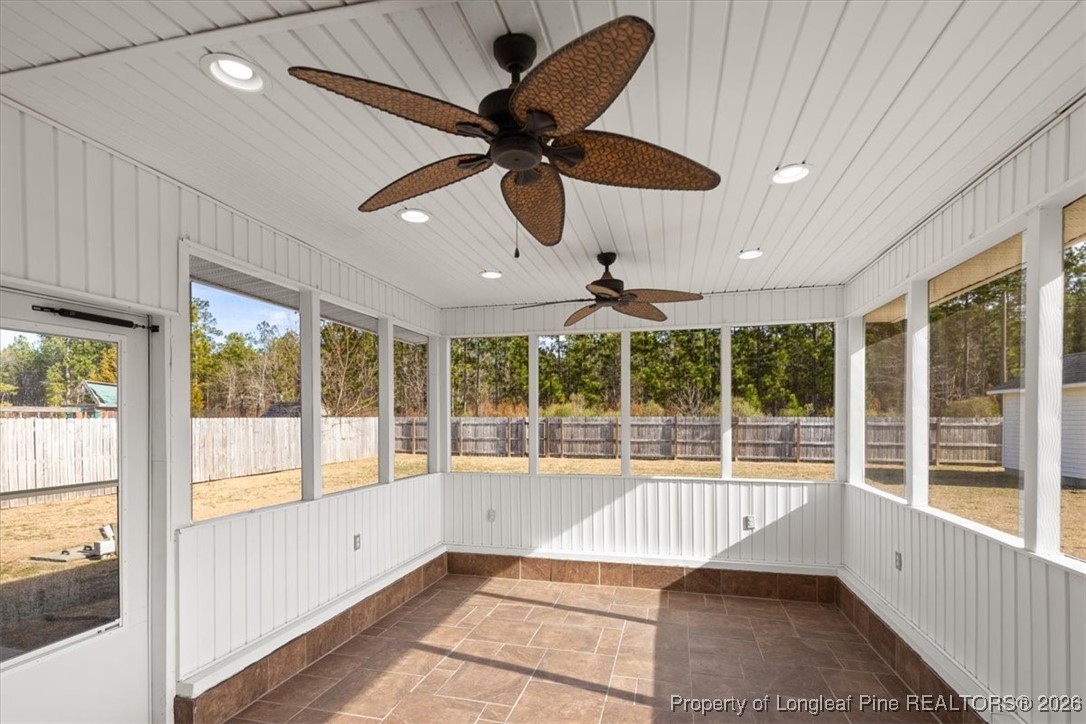 6649 Hillbrook Road Hope Mills, NC 28348 - Photo 16 of 37 a view of an empty room with a floor to ceiling window and a ceiling fan