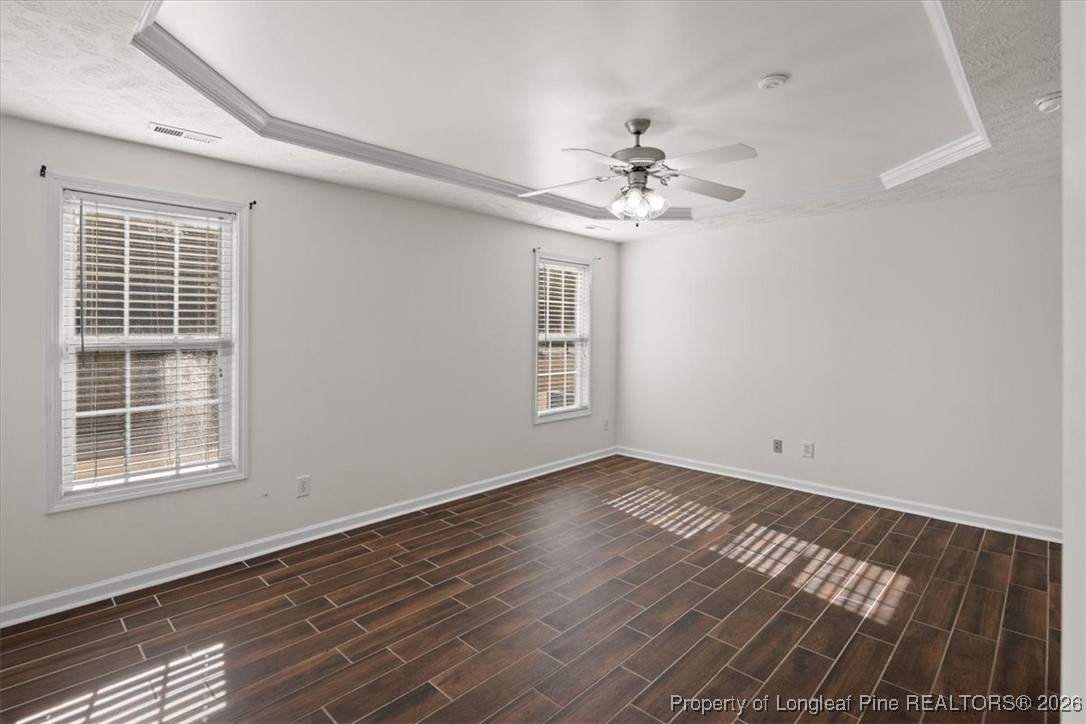 6649 Hillbrook Road Hope Mills, NC 28348 - Photo 19 of 37 a view of an empty room with a window and wooden floor