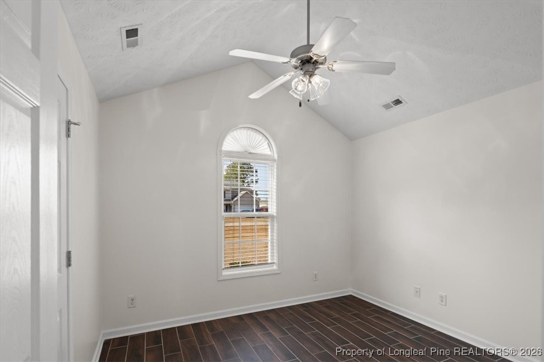 6649 Hillbrook Road Hope Mills, NC 28348 - Photo 25 of 37 a view of an empty room with a window and wooden floor