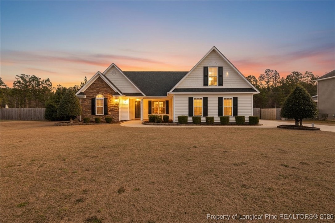 6649 Hillbrook Road Hope Mills, NC 28348 - Photo 37 of 37 a front view of a house with a yard