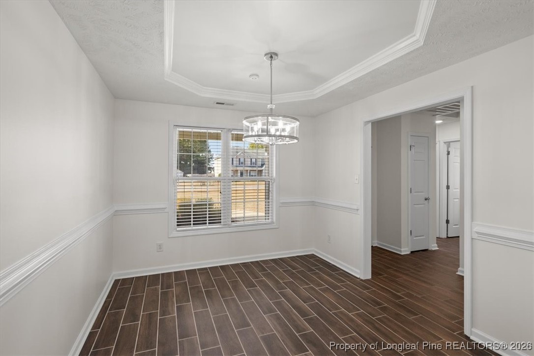 6649 Hillbrook Road Hope Mills, NC 28348 - Photo 8 of 37 a view of an empty room with wooden floor and a window