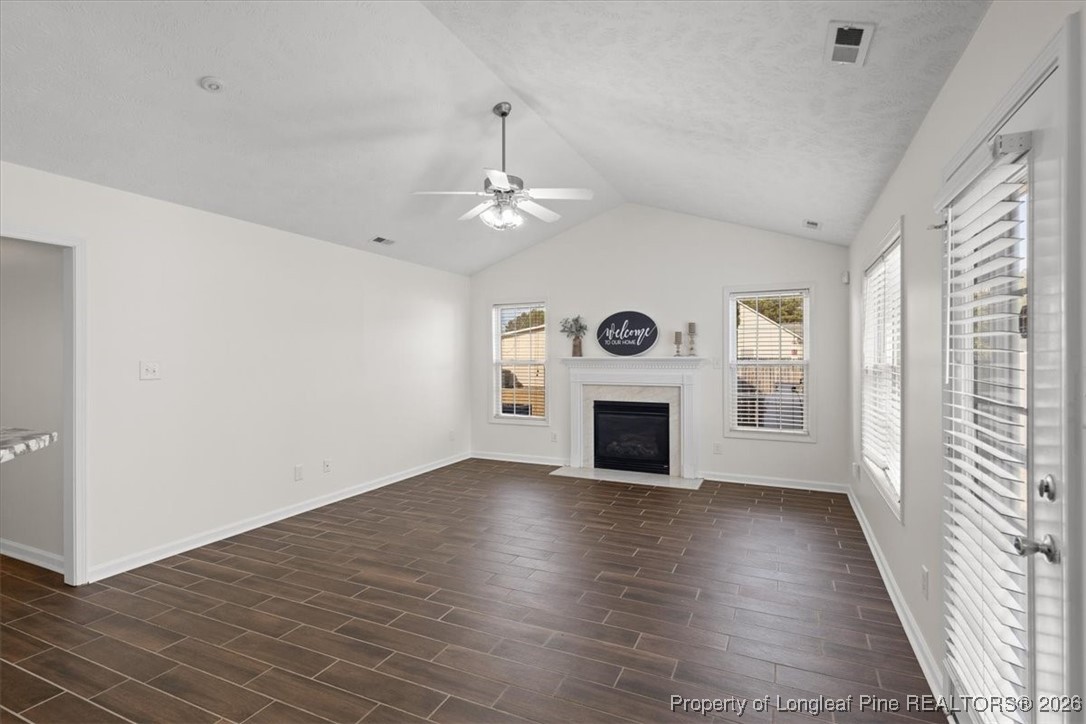 6649 Hillbrook Road Hope Mills, NC 28348 - Photo 10 of 37 an empty room with windows and fireplace