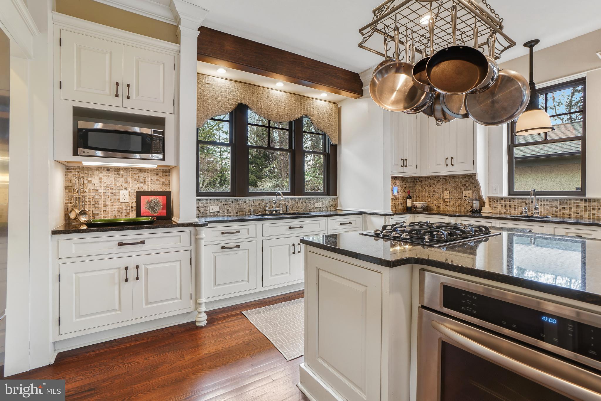 4201 Military Road Northwest Washington, DC 20015 - Photo 12 of 49 a kitchen with stainless steel appliances granite countertop a stove and a microwave