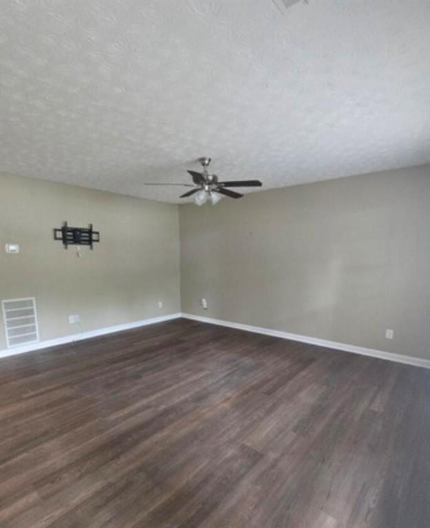 2881 Norfair Loop Lithonia, GA 30038 - Photo 3 of 5 a view of an empty room with wooden floor
