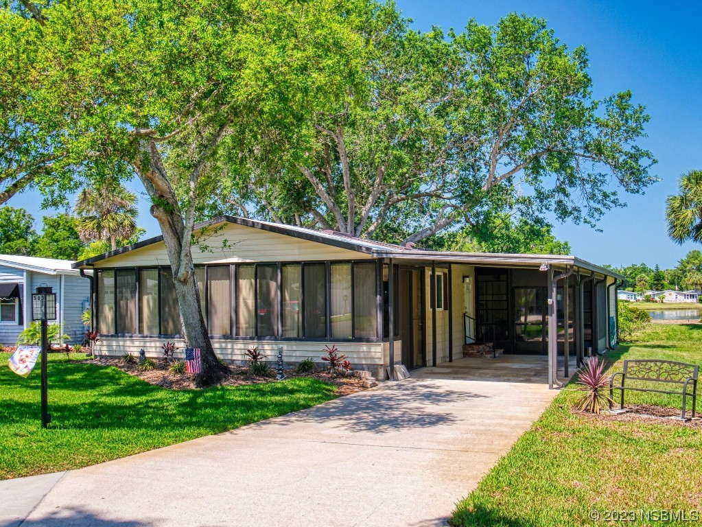 a view of a house with garden and yard