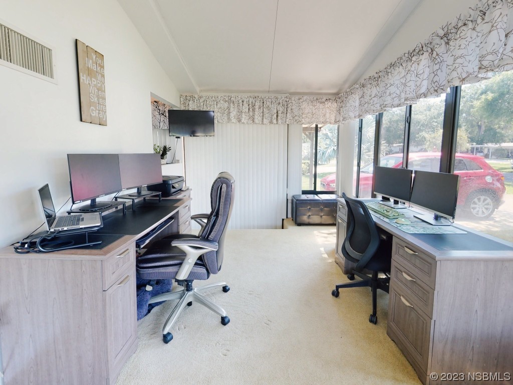 503 Halyard Circle Edgewater, FL 32141 - Photo 17 of 50 a view of a workspace with furniture and a window