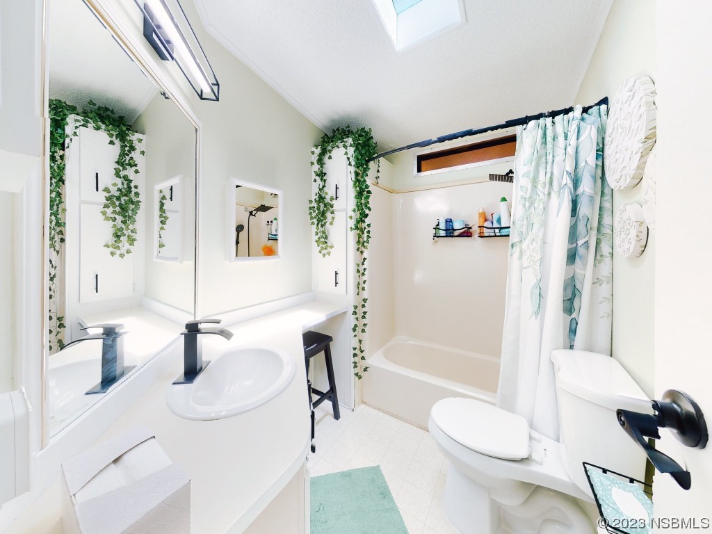 503 Halyard Circle Edgewater, FL 32141 - Photo 23 of 50 a bathroom with a sink toilet and shower