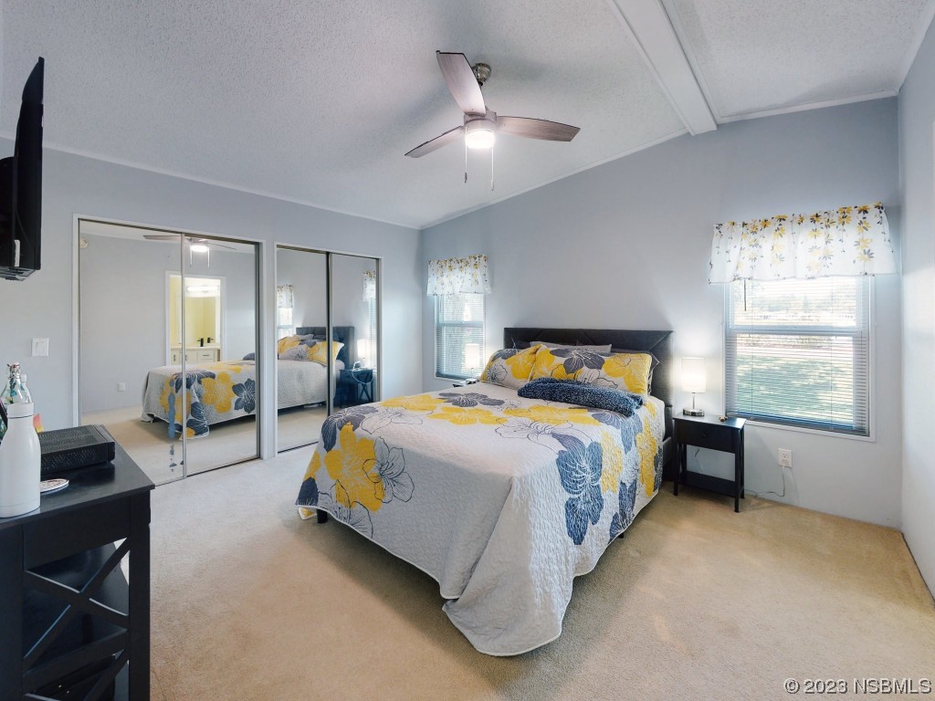 503 Halyard Circle Edgewater, FL 32141 - Photo 24 of 50 a bed room with a bed and a tv