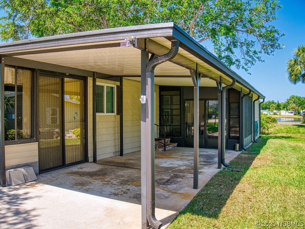 503 Halyard Circle Edgewater, FL 32141 - Photo 3 of 50 a view of a patio with table and chairs