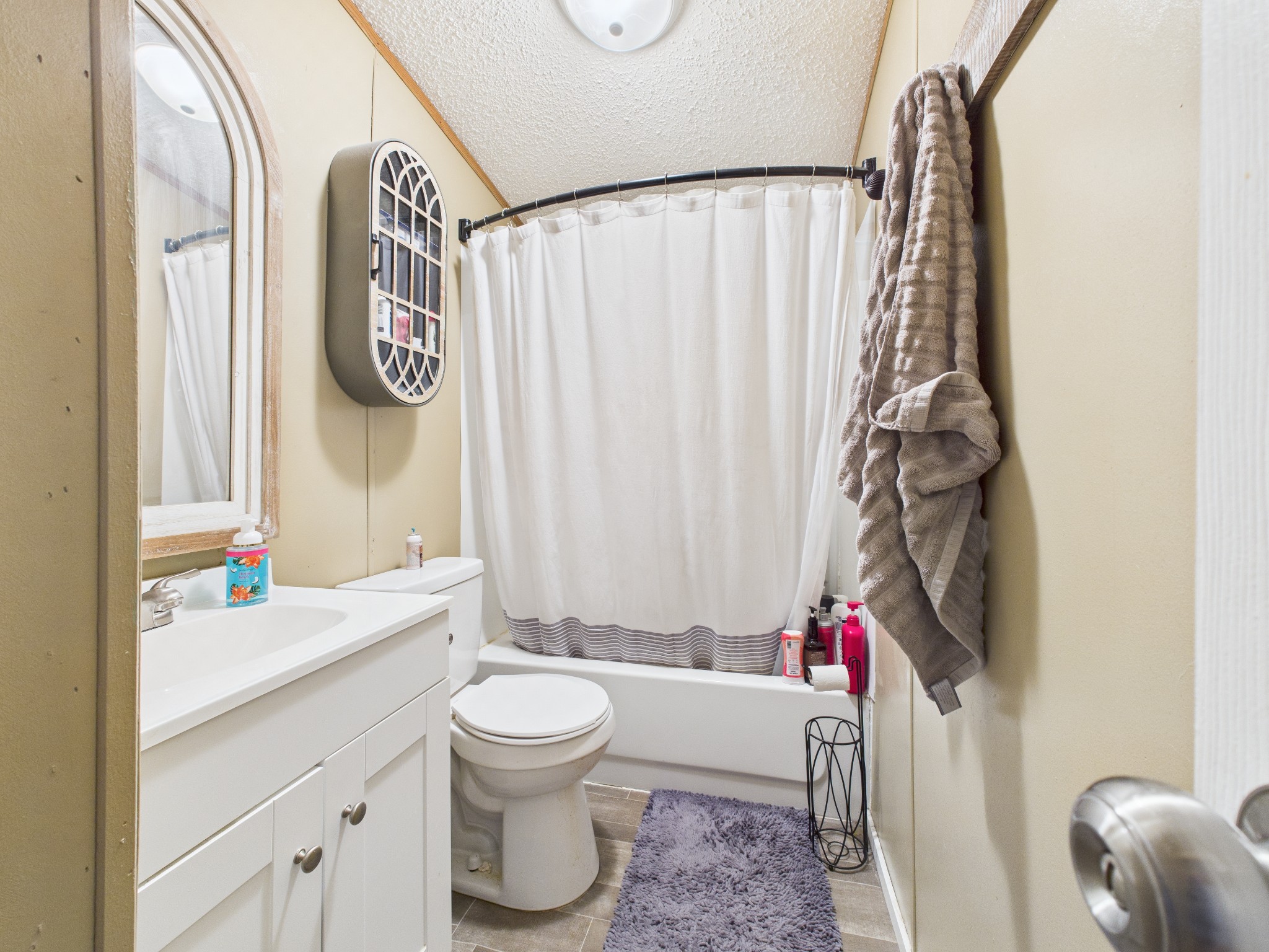 59 Spring Road Morrison, TN 37357 - Photo 14 of 18 a bathroom with a sink toilet and shower