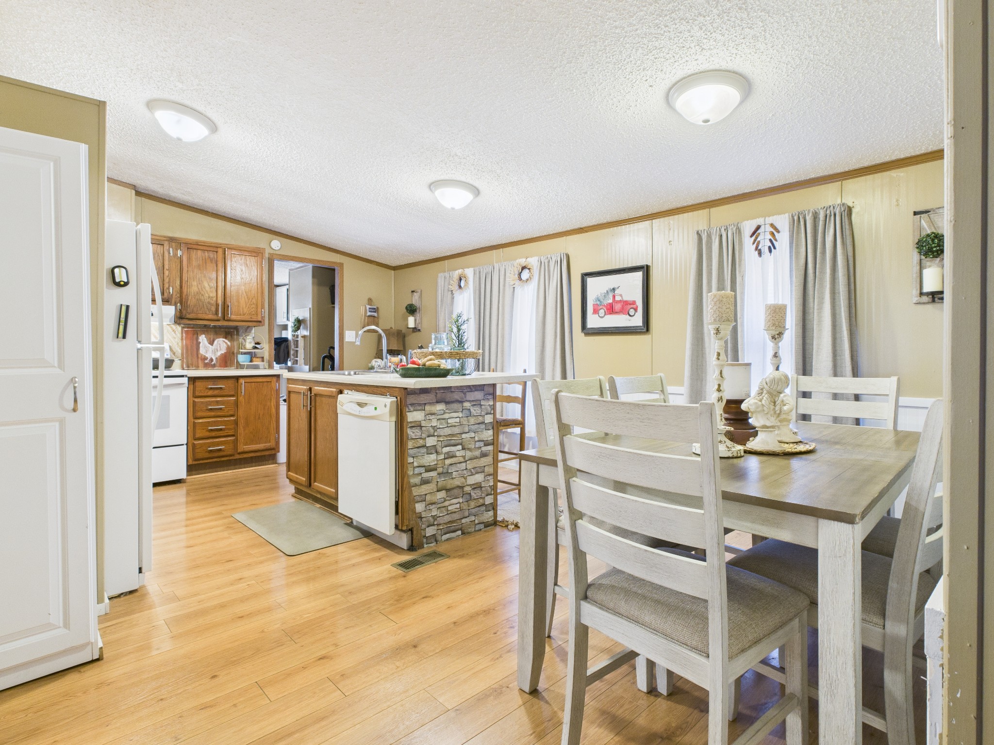 59 Spring Road Morrison, TN 37357 - Photo 7 of 18 a kitchen with stainless steel appliances granite countertop a refrigerator and a stove top oven