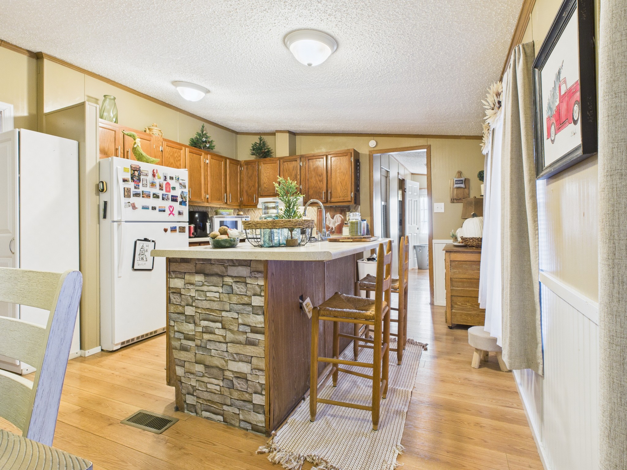59 Spring Road Morrison, TN 37357 - Photo 8 of 18 a kitchen with stainless steel appliances kitchen island granite countertop a refrigerator and a stove