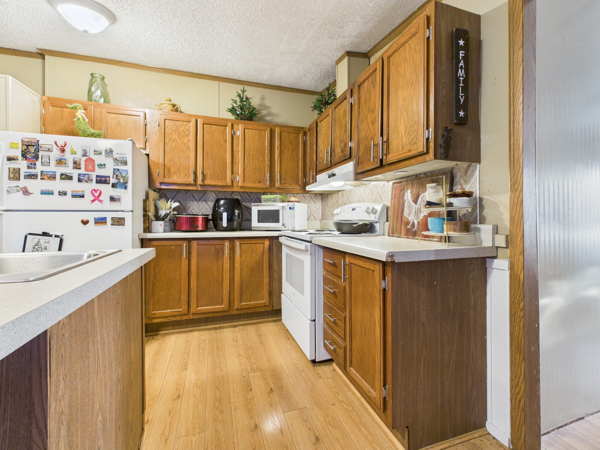 59 Spring Road Morrison, TN 37357 - Photo 9 of 18 a kitchen with a sink stove and cabinets