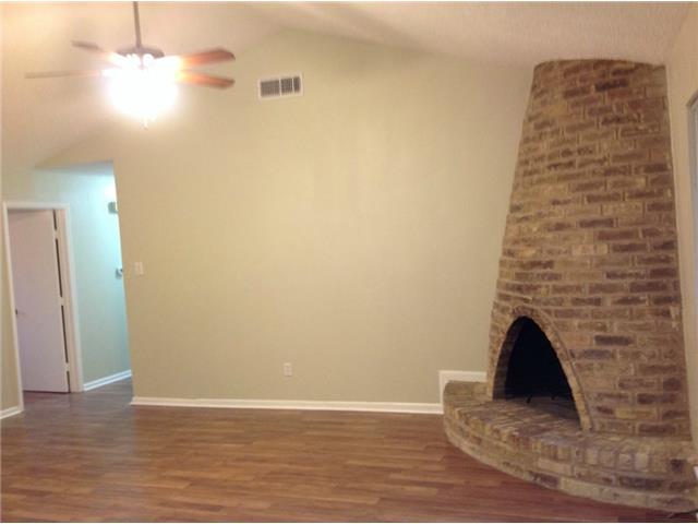 1601 Rutland Drive, Unit A Austin, TX 78758 - Photo 4 of 7 a view of a livingroom with wooden floor and a ceiling fan