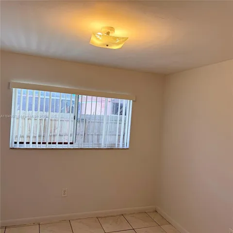 a bathroom with a bathtub and a toilet