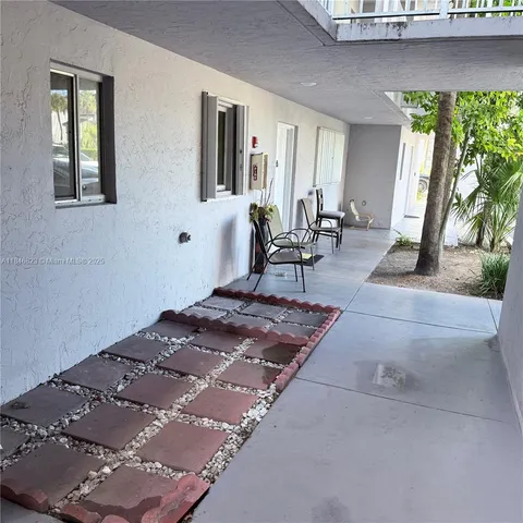 a bedroom with a bed and glass windows