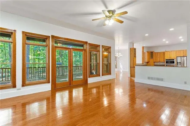 a kitchen with stainless steel appliances granite countertop a refrigerator and a stove top oven