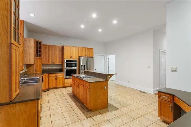 a kitchen with a stove and a refrigerator