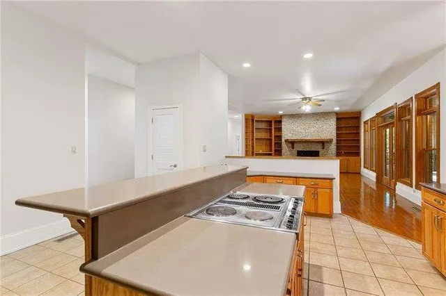 a spacious bathroom with a tub and mirror