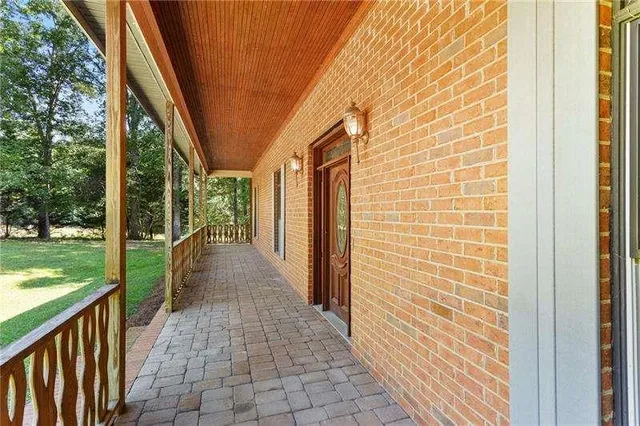 a view of an entryway with wooden floor