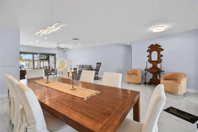 a dining room with furniture and wooden floor