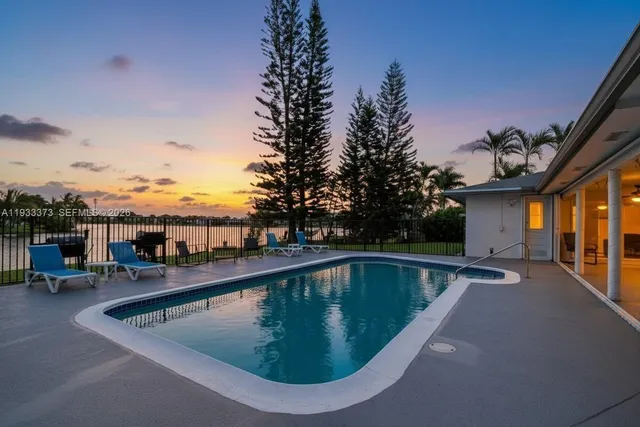 a view of a swimming pool with a lounge chair