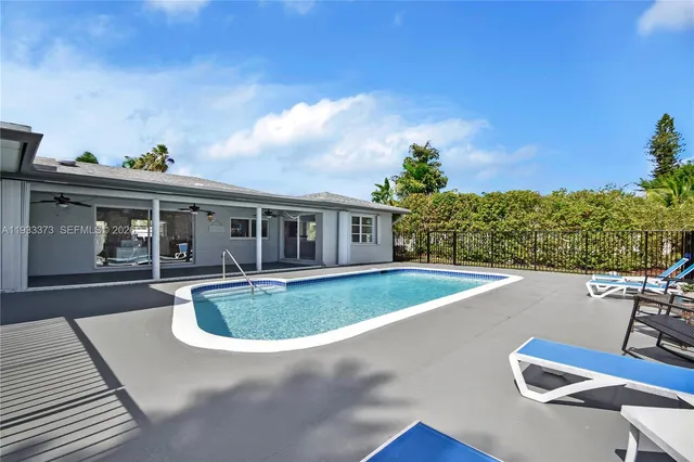 a view of pool with outdoor seating