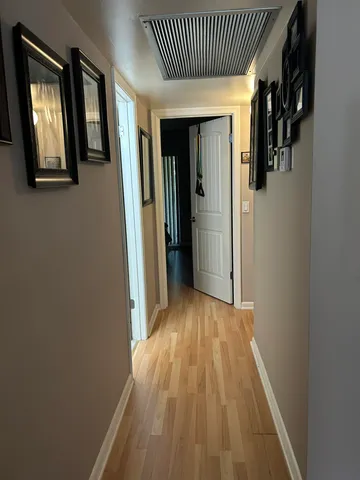 a bedroom with a large bed and a view of bedroom