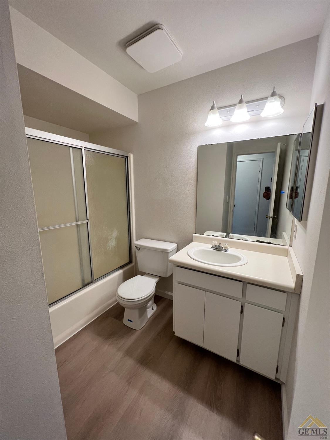 Undisclosed Address Wasco, CA 93280 - Photo 11 of 17 a bathroom with a toilet sink and mirror