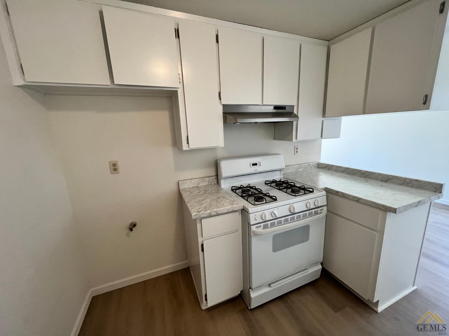 Undisclosed Address Wasco, CA 93280 - Photo 5 of 17 a white stove top oven sitting inside of a kitchen