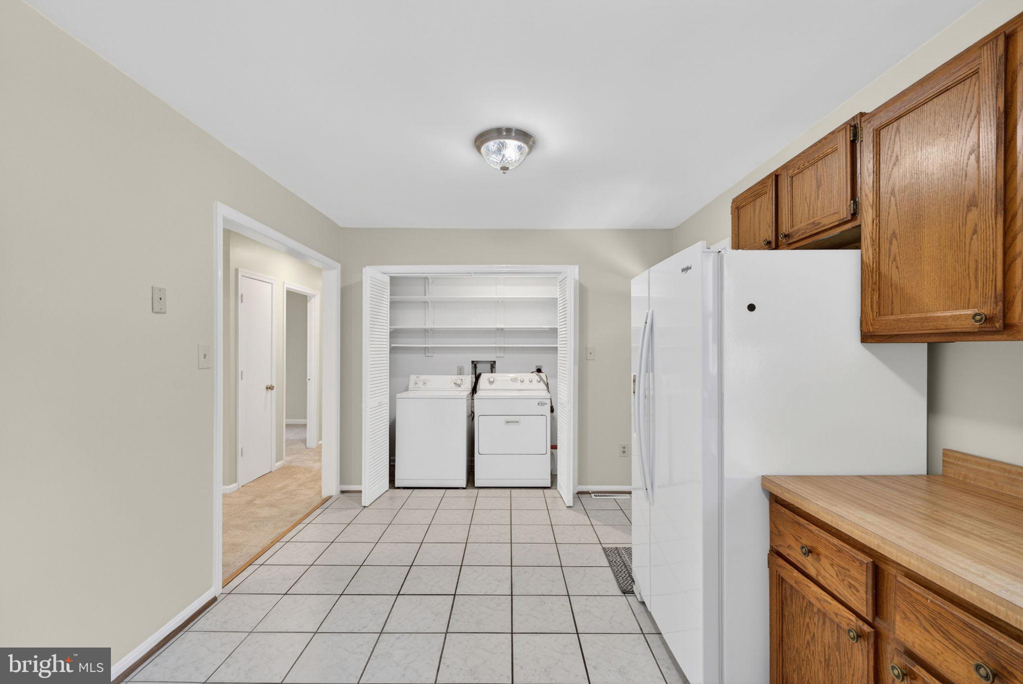 9283 Springs Road Warrenton, VA 20186 - Photo 11 of 18 a view of a livingroom with wooden floor and cabinets