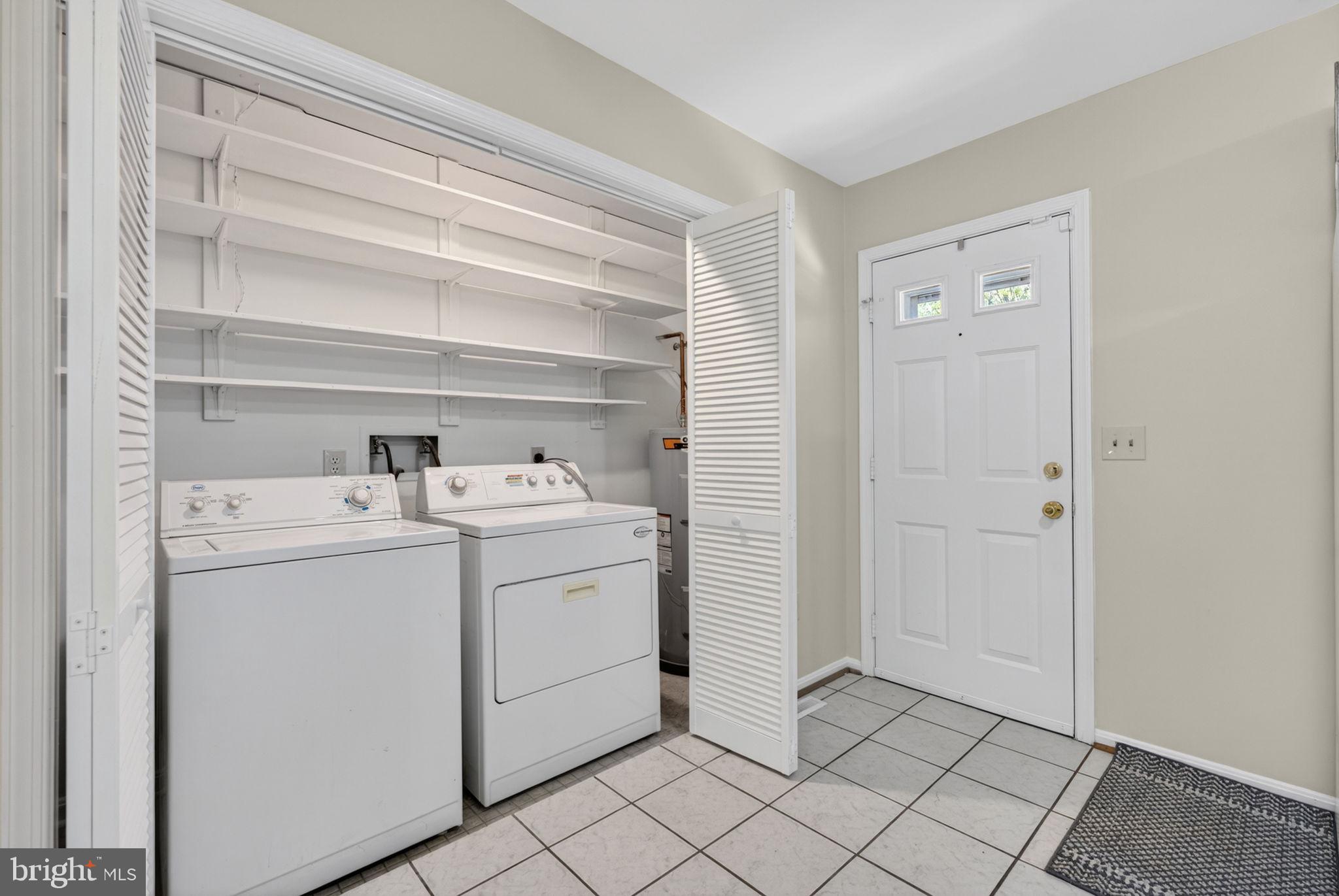 9283 Springs Road Warrenton, VA 20186 - Photo 12 of 18 a utility room with dryer and washer